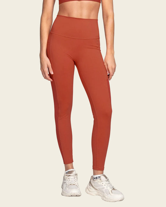 Legging deportivo con bolsillo lateral y detalles en tul#color_336-rojo-canela