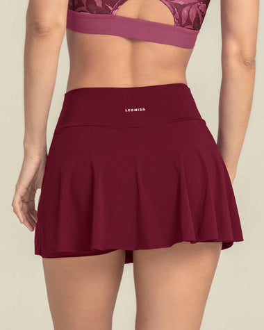 Falda deportiva con short interno con bolsillo#color_220-vino-tinto