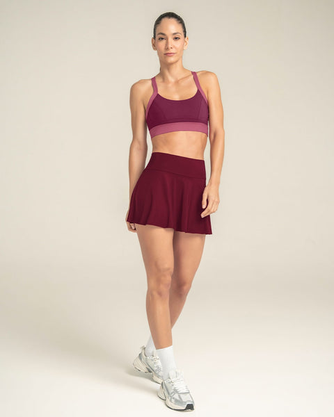 Falda deportiva con short interno con bolsillo#color_220-vino-tinto