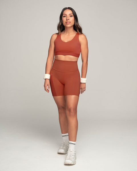 Top deportivo espalda atlética con detalles en tul#color_336-rojo-canela